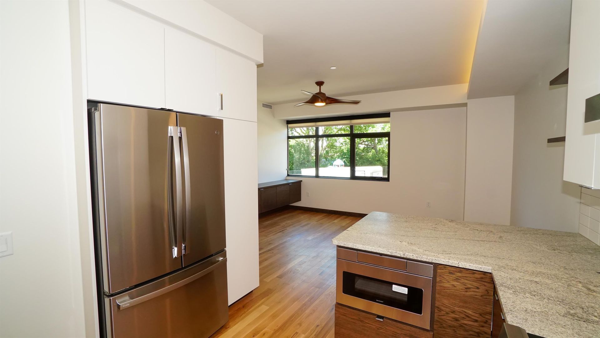 A kitchen with stainless steel appliances and granite counter tops