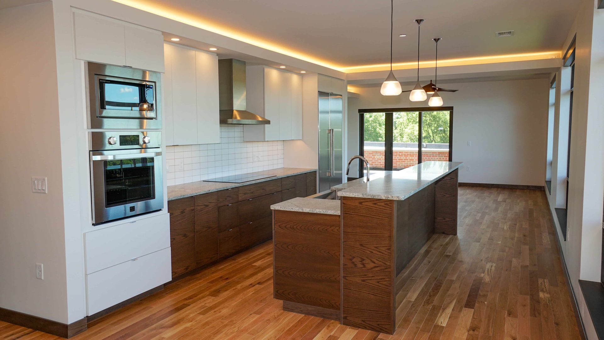 There is a large island in the middle of the kitchen.