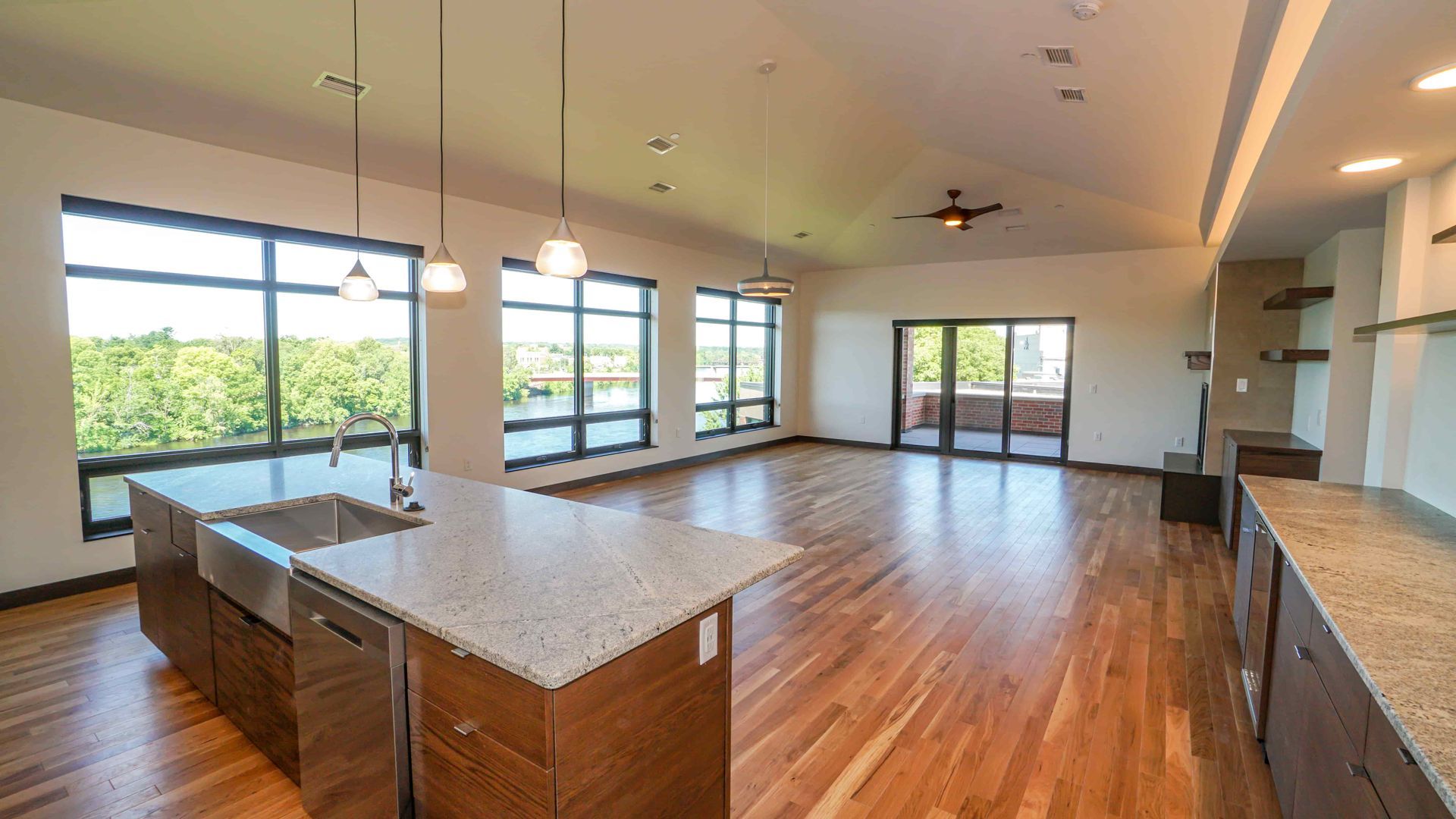 A kitchen with a large island and stainless steel appliances