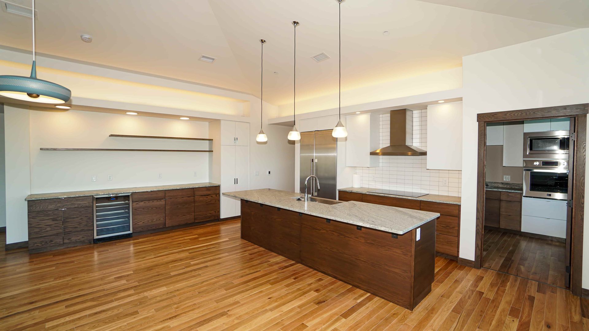 There is a large island in the middle of the kitchen.