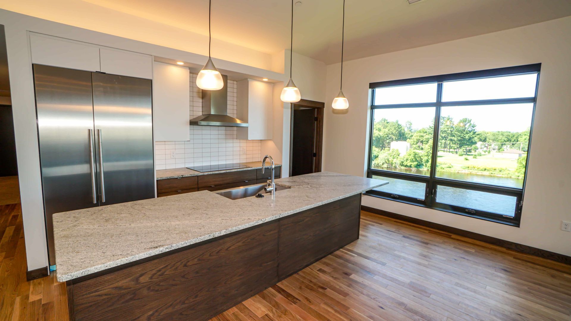 There is a large island in the middle of the kitchen.