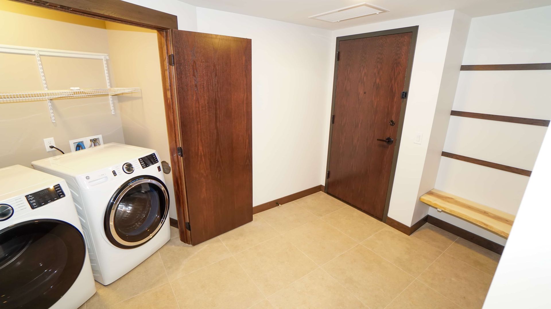 A laundry room with a washer and dryer in it.