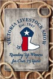 Victoria Livestock Show sign with Texas flag boot, rope border.