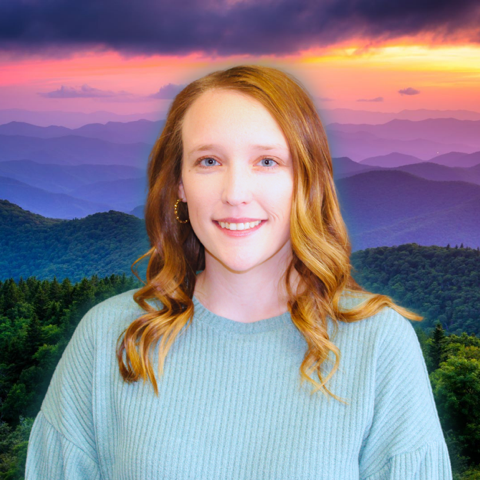 A man is sitting on a couch talking to two older people.