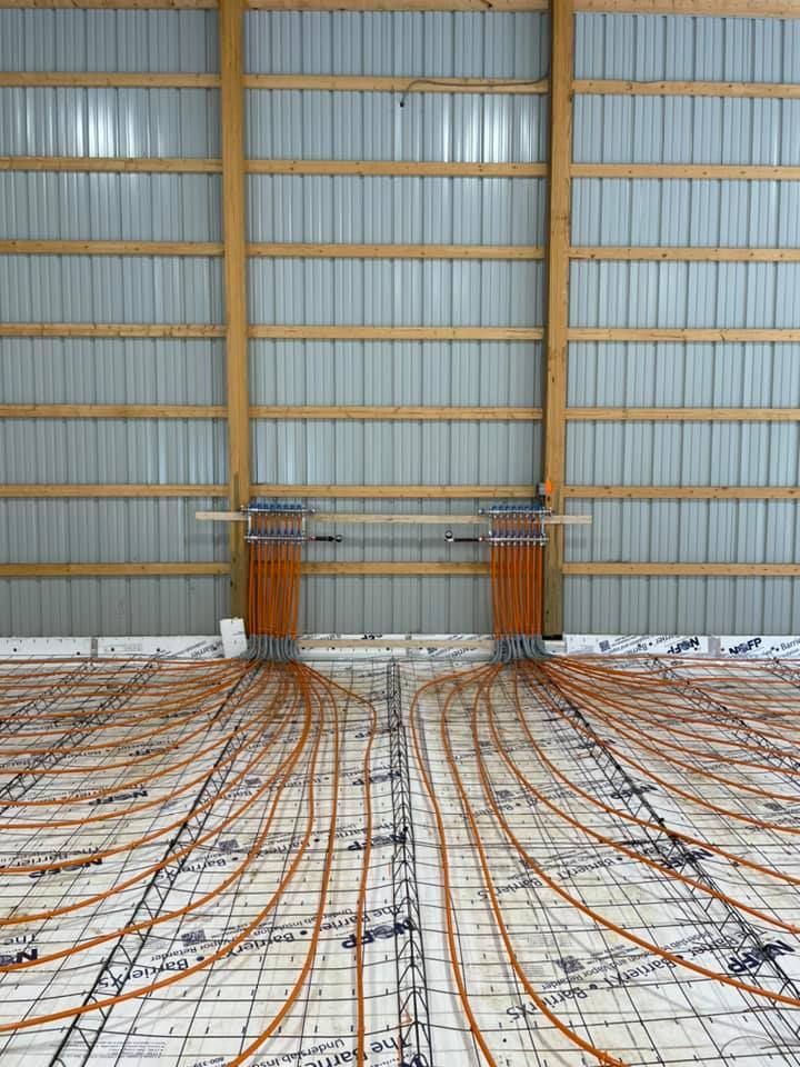 A large building with a lot of wires on the floor.