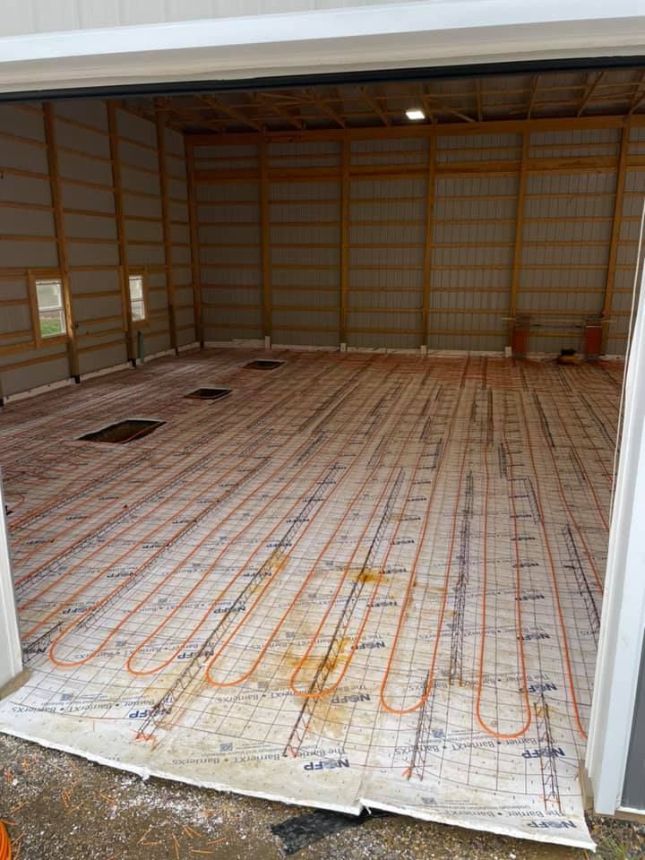A garage with a heated floor being installed in it.