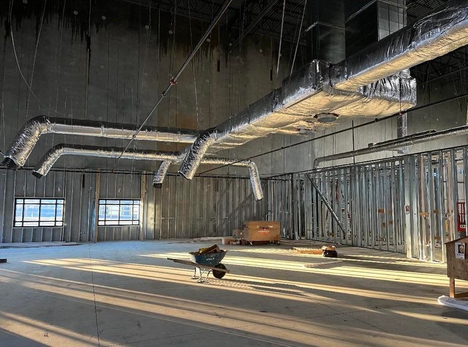 There is a wheelbarrow in the middle of the room.