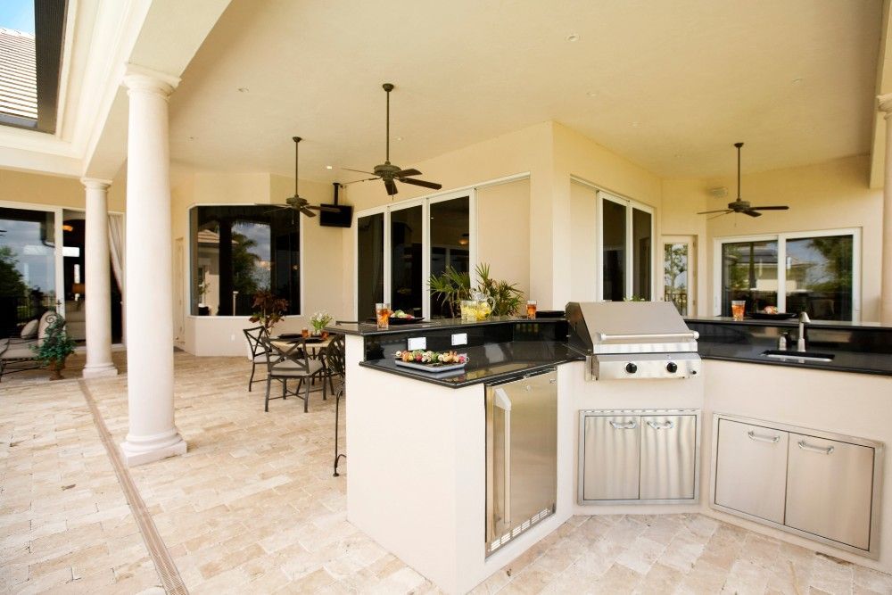 Outdoor kitchen with stone flooring in St. Louis, MO