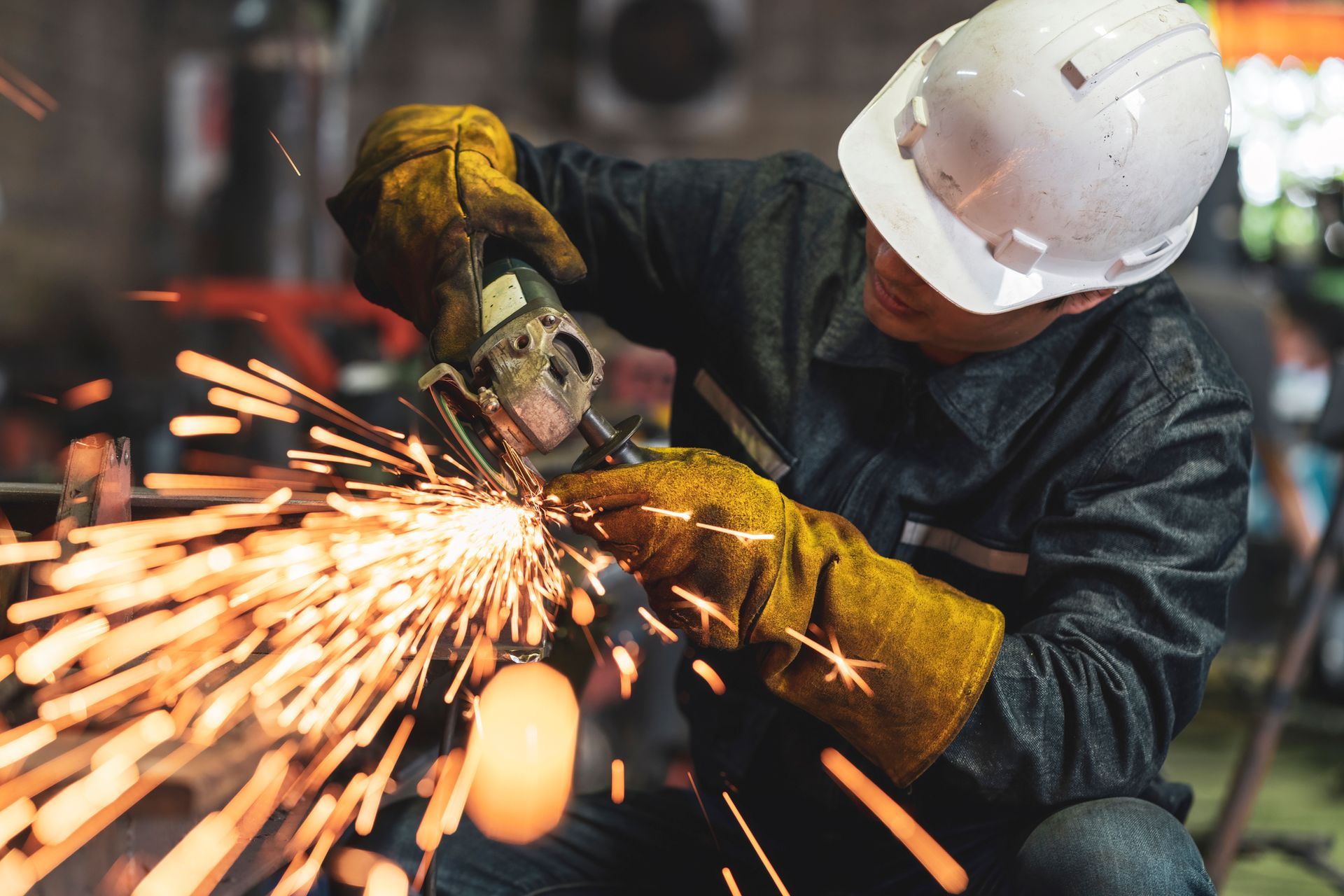 Man worker using grinder to polish the metal surface, showcasing welding repair services. Man worker using grinder to polish the metal surface, showcasing welding repair services.