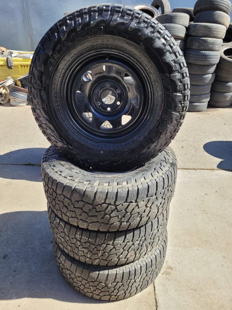 A Stack of Tyres With a Wheel on Top of Them — ARB Budget Tyres in Delacombe, VIC