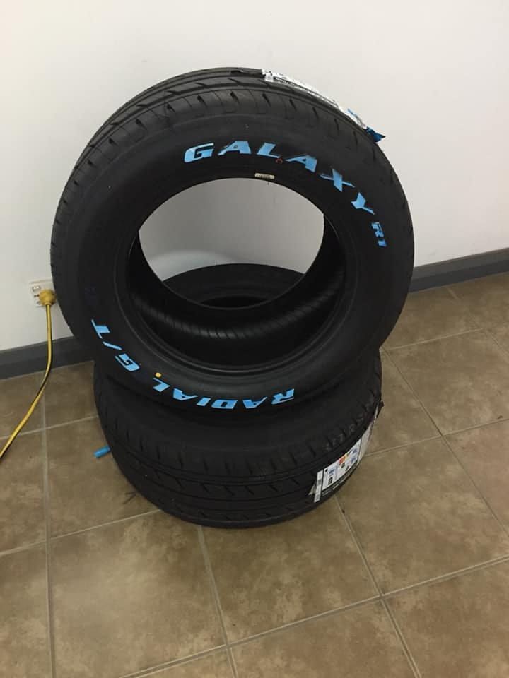 Two Tyres Are Stacked on Top of Each Other on a Tiled Floor — ARB Budget Tyres in Delacombe, VIC