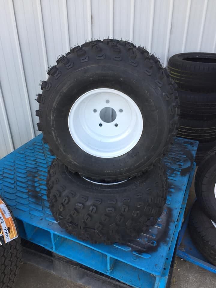 Two Tyres Are Stacked on Top of Each Other on a Blue Pallet — ARB Budget Tyres in Delacombe, VIC