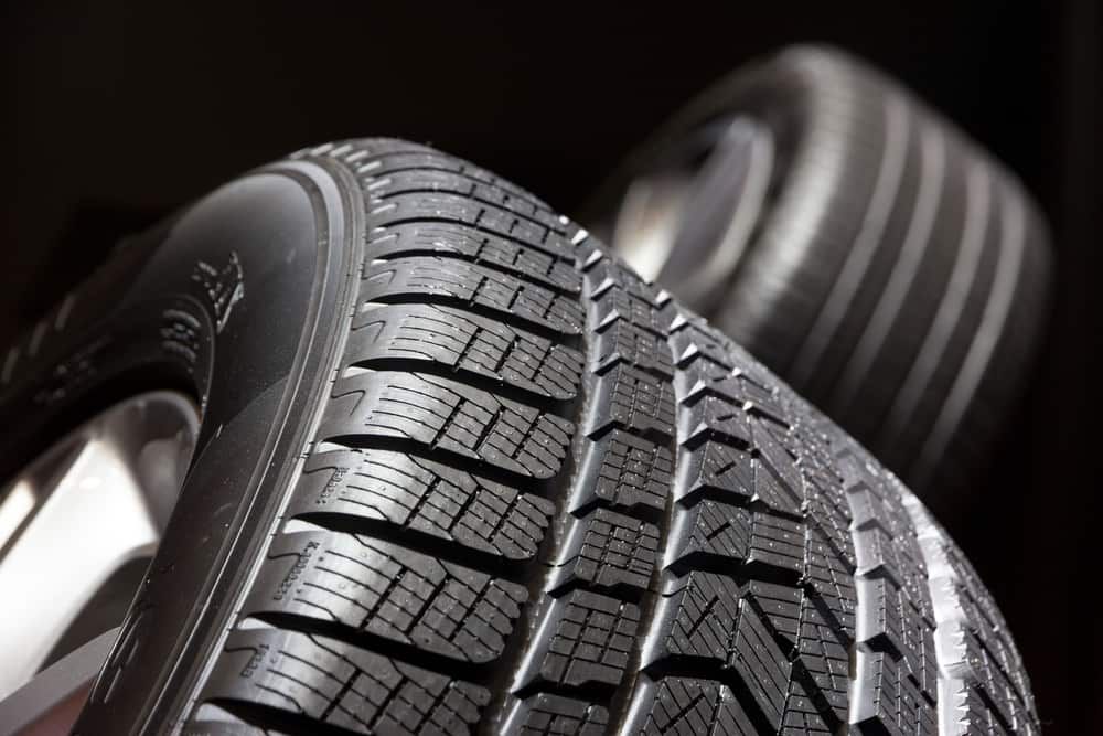 Two Tyres Are Stacked on Top of Each Other on a Black Background — ARB Budget Tyres in Delacombe, VIC