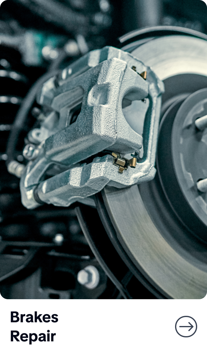 Close-up of a car brake caliper and disc with “Brakes Repair” label below | Bob's Main Street Auto & Towing