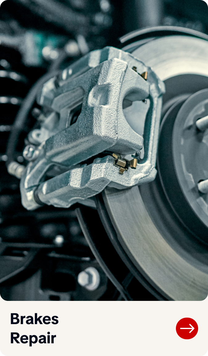 Close-up of a car brake caliper and disc with “Brakes Repair” label below | Bob's Main Street Auto & Towing