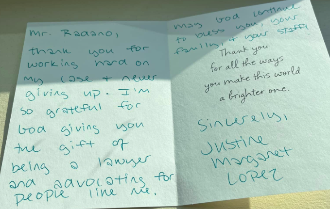A thank you note is written on a piece of paper