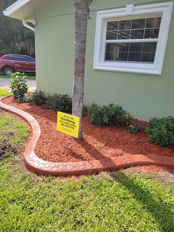A house with a tree and a sign in front of it.