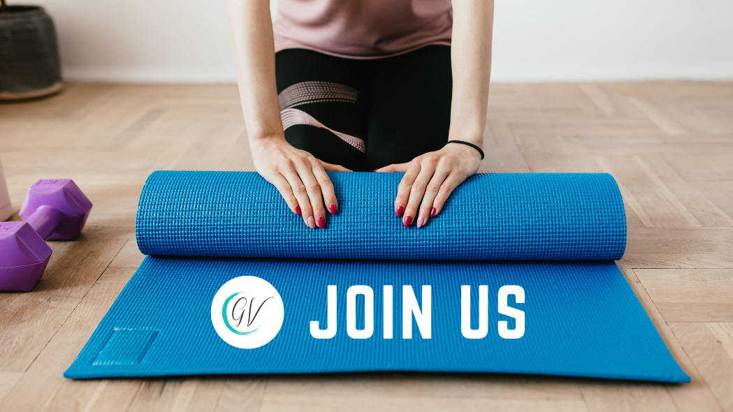 Woman beginning pilates class unrolling her yoga mat with the words Join Us