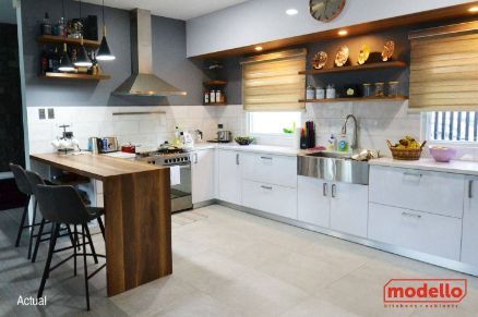 A Kitchen With White Cabinets and Stainless Steel Appliances — ModulPlus in Hervey Bay, QLD