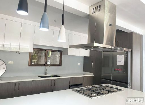 A Kitchen With a Stove Top Oven and a Refrigerator — ModulPlus in Hervey Bay, QLD