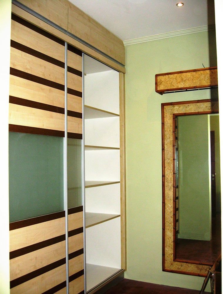 A Closet With Sliding Doors and a Mirror on the Wall — ModulPlus in Hervey Bay, QLD