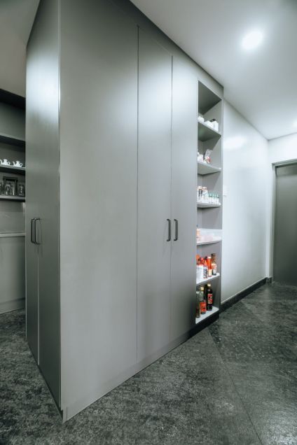 A Corner of a Room With Gray Cabinets and Shelves — ModulPlus in Hervey Bay, QLD