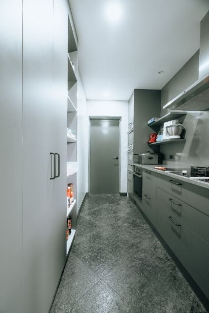 A Kitchen With a Long Hallway Leading to a Door — ModulPlus in Hervey Bay, QLD