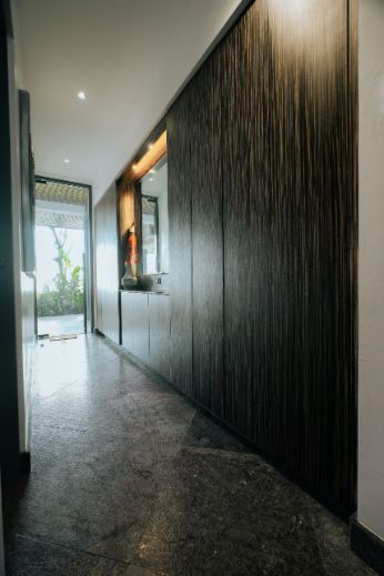 A Long Hallway With a Marble Floor and Wooden Walls Leading to a Bathroom — ModulPlus in Hervey Bay, QLD