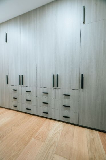 A Room With a Lot of Cabinets and Drawers on the Wall — ModulPlus in Hervey Bay, QLD