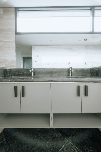 A Bathroom With Two Sinks and a Large Mirror — ModulPlus in Hervey Bay, QLD