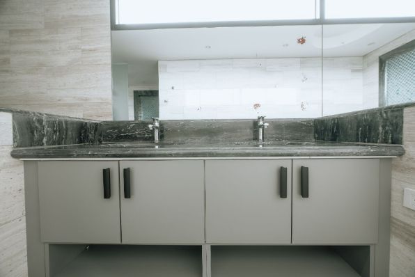 A Bathroom With Two Sinks and a Large Mirror — ModulPlus in Hervey Bay, QLD