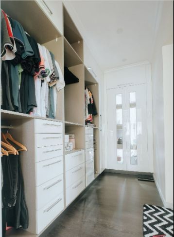 A Walk in Closet Filled With Clothes and Drawers — ModulPlus in Hervey Bay, QLD
