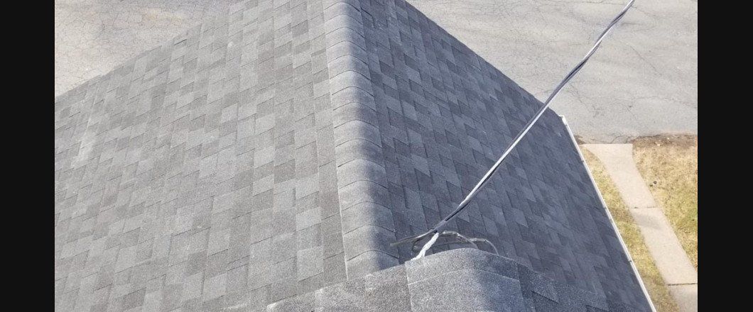 A person is flying a kite on top of a pyramid.