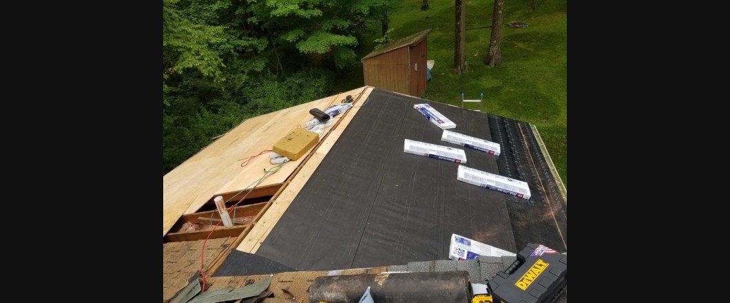 A roof is being installed on a house.