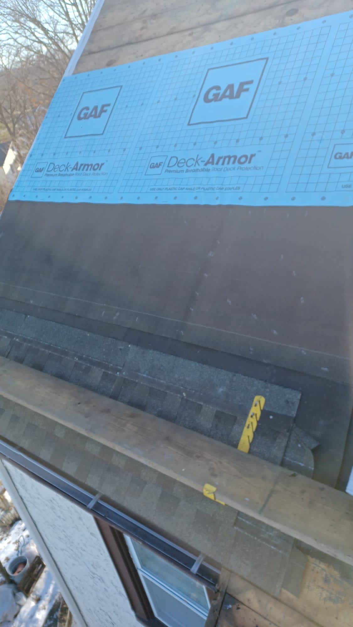 A close up of a roof with shingles on it.