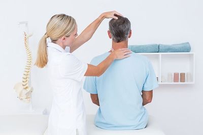 Doctor Doing Neck Adjustment — Springfield, MO — James River Chiropractic & Wellness