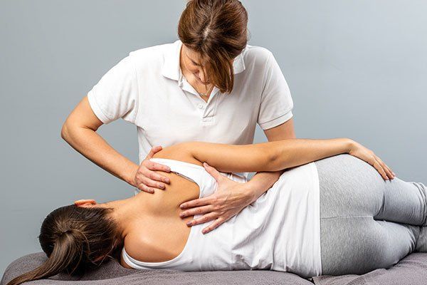 Shoulder Blade Therapy on Woman — Springfield, MO — James River Chiropractic & Wellness