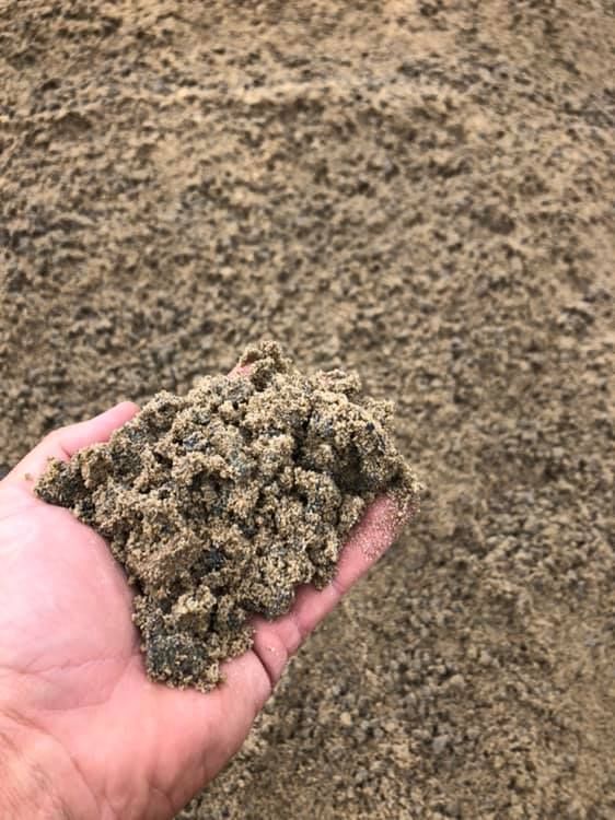 hand holding concrete mix in hands— Garden Supplies Mid North Coast, NSW