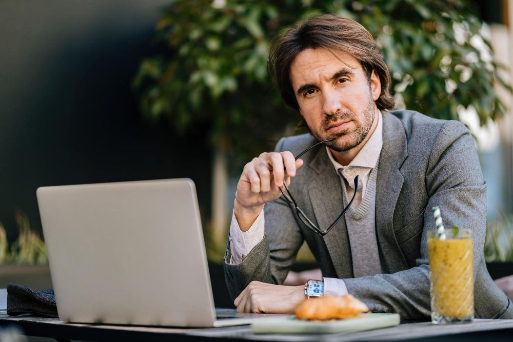 Entrepreneur reviewing business funding options on laptop