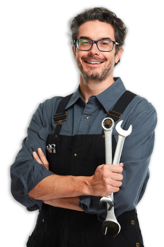 Mechanic with eyeglasses and tools, smiling, wearing overalls.