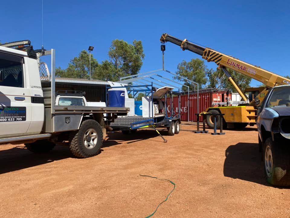 Truck With Trailer and Crane Lifting Metal Structure — Lincoln Fabrication in Normanton, QLD