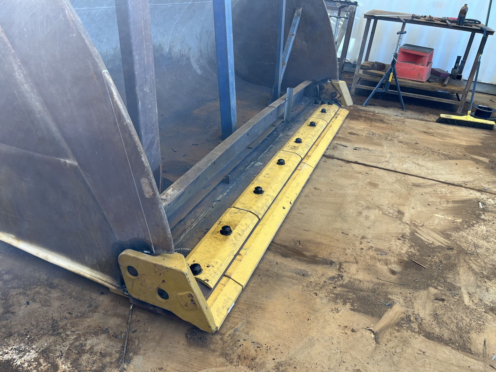 Yellow Steel Edge Bolted Onto a Large Loader Bucket — Lincoln Fabrication in Cloncurry, QLD