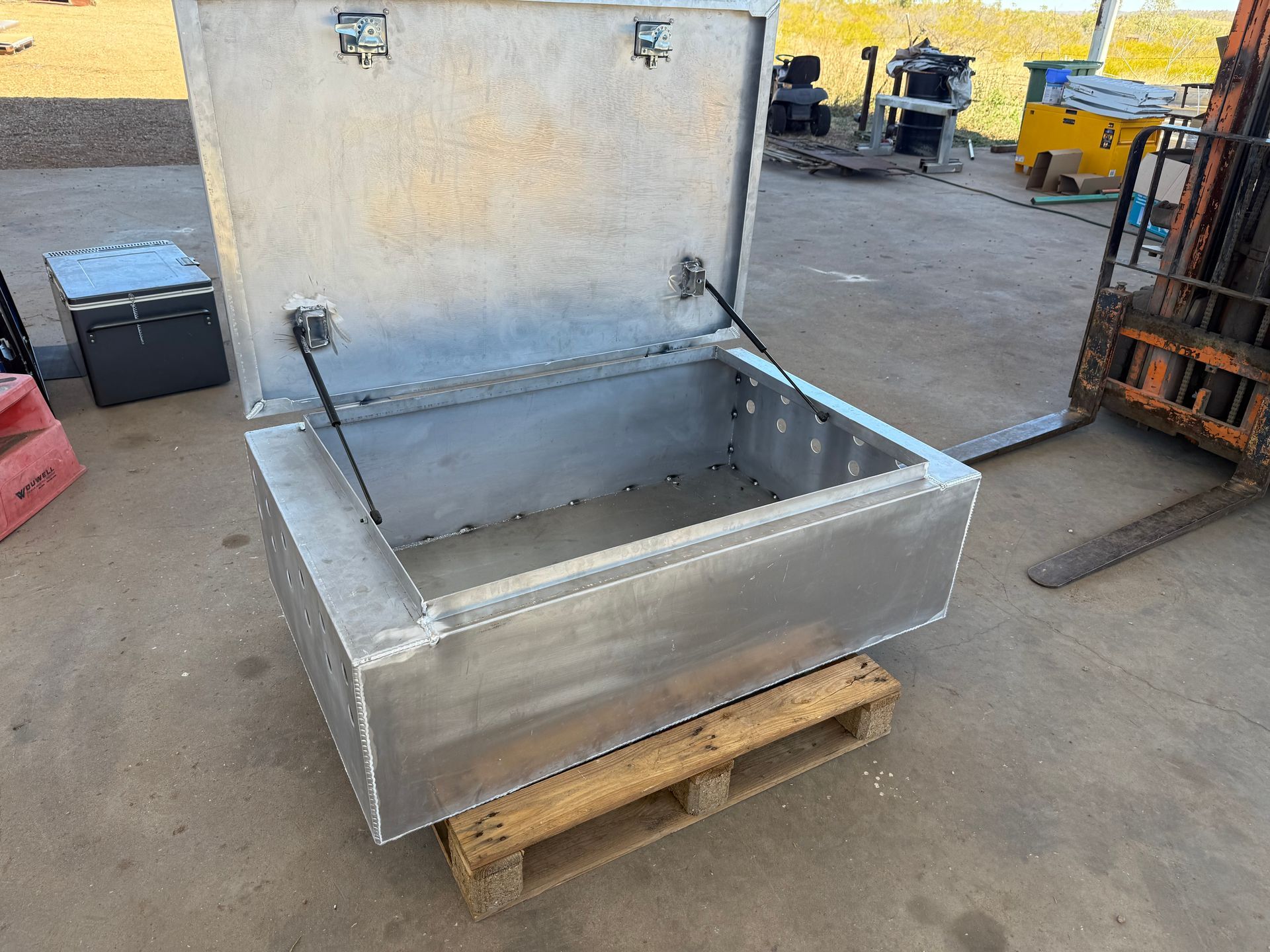 Aluminum Storage Box With Open Lid on a Wooden Pallet — Lincoln Fabrication in Miles End, QLD