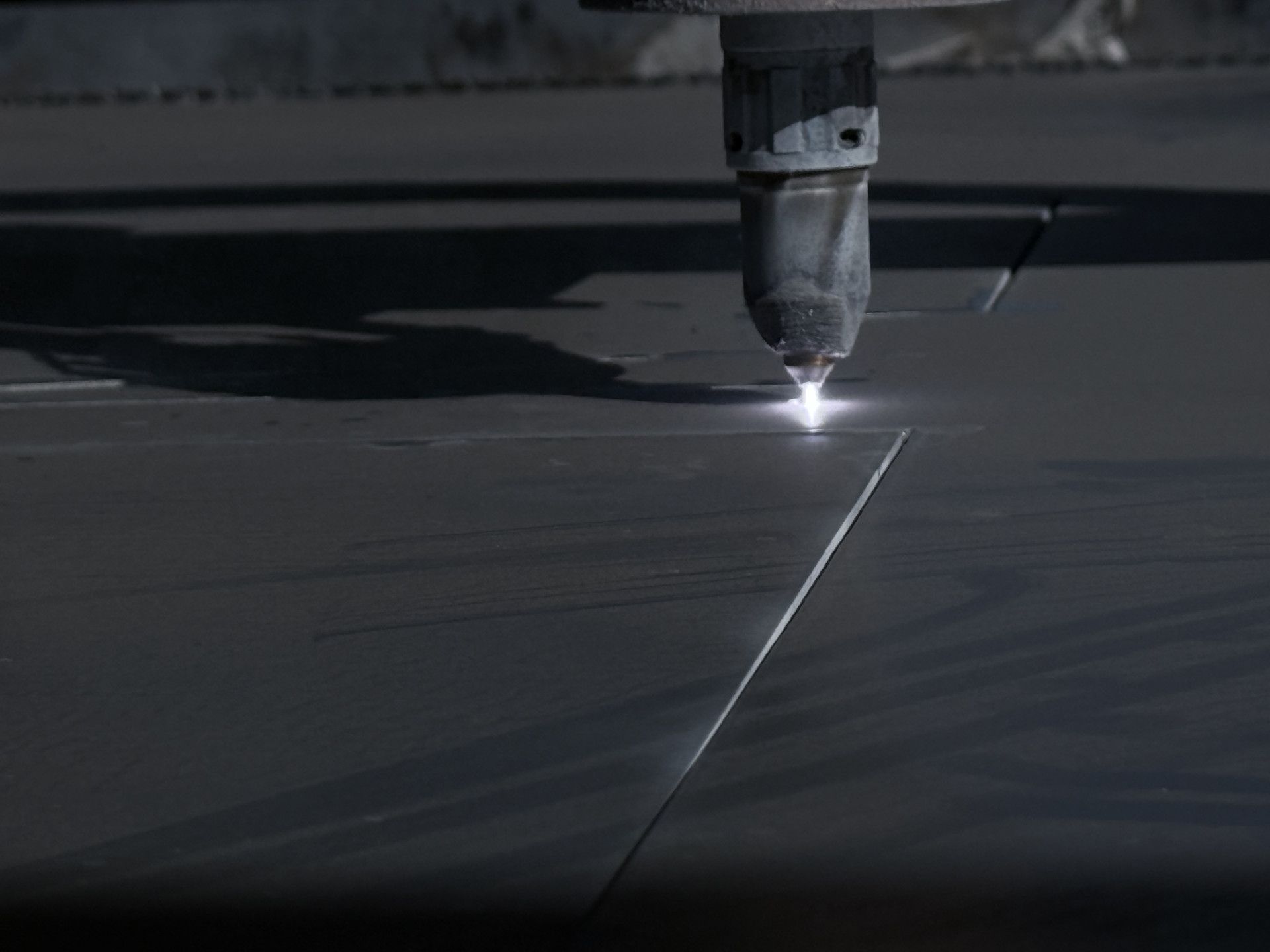 A Metal Sheet Being Cut by a Plasma Cutter — Lincoln Fabrication in Miles End, QLD
