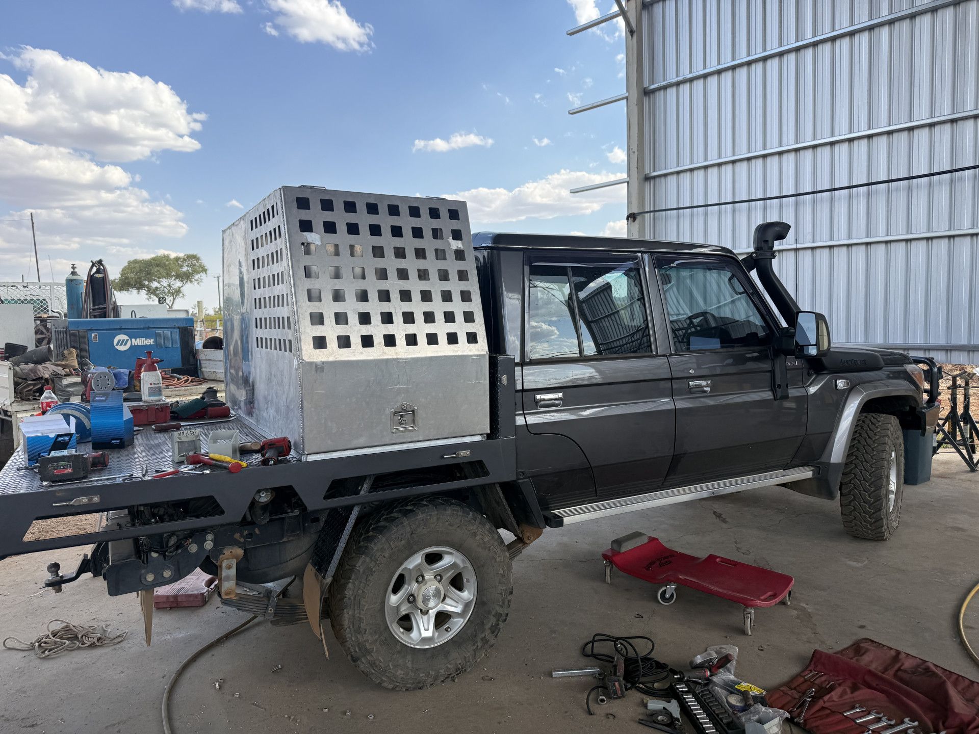 Black Truck With a Metal Utility Tray and Cage — Lincoln Fabrication in Miles End, QLD