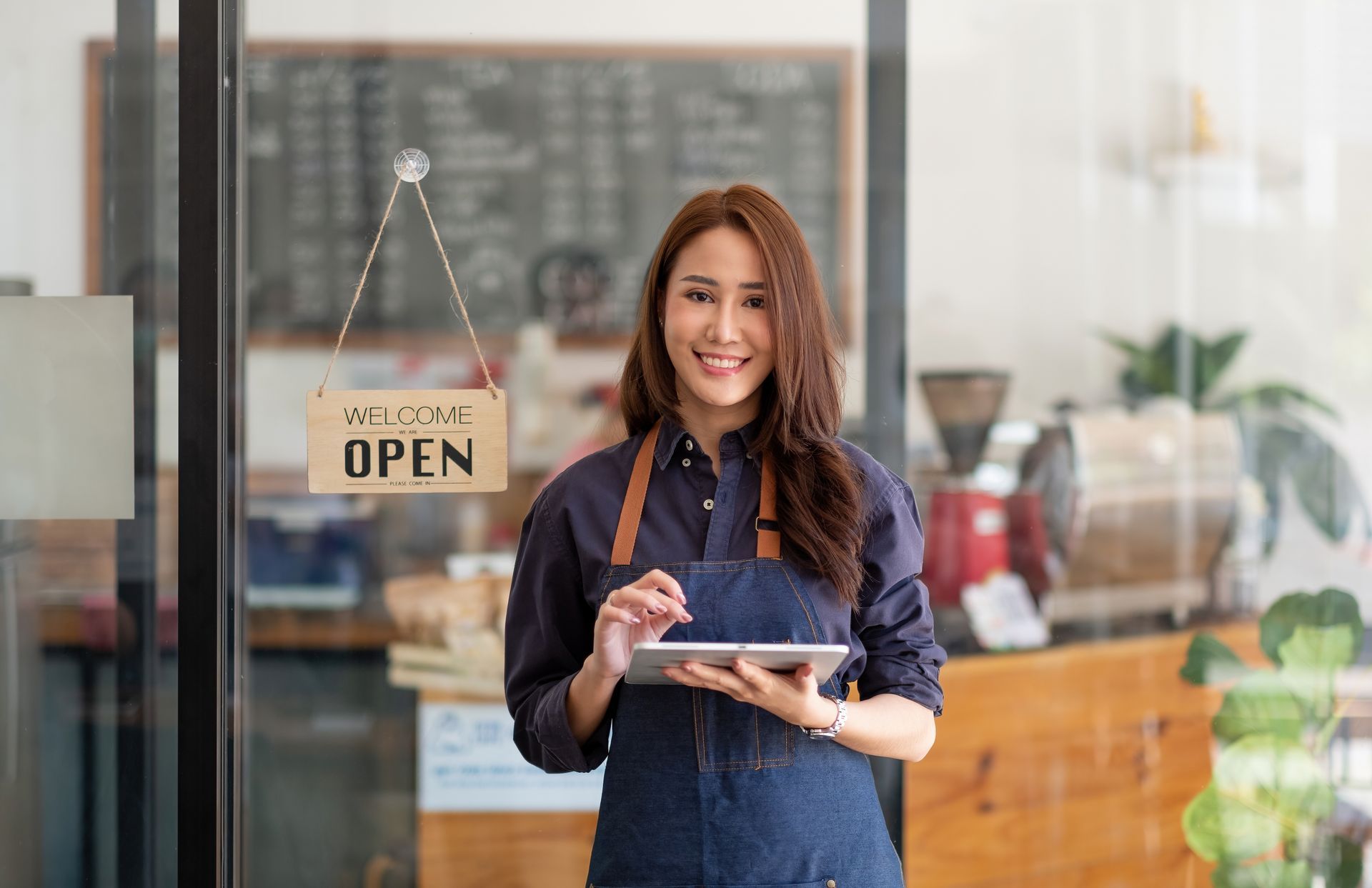 business owner holding a tablet