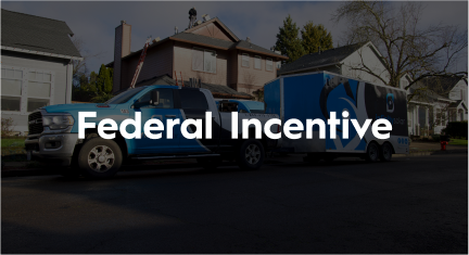 A blue truck with a trailer attached to it is parked in front of a house.