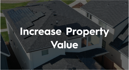 An aerial view of a house with solar panels on the roof.