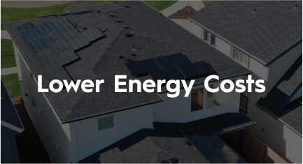 An aerial view of a house with solar panels on the roof.