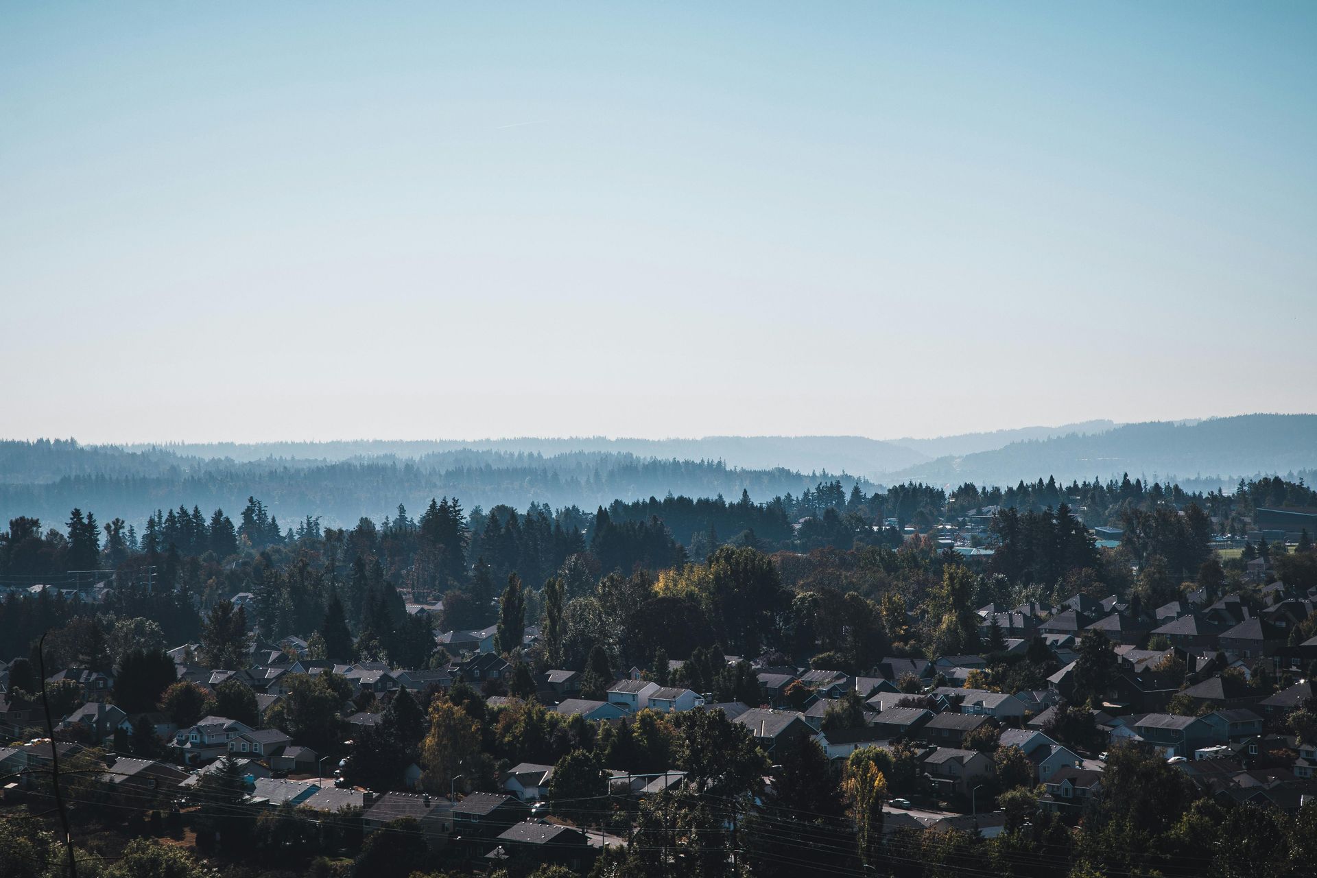 The skyline of New Jersey is reflected in a lake.